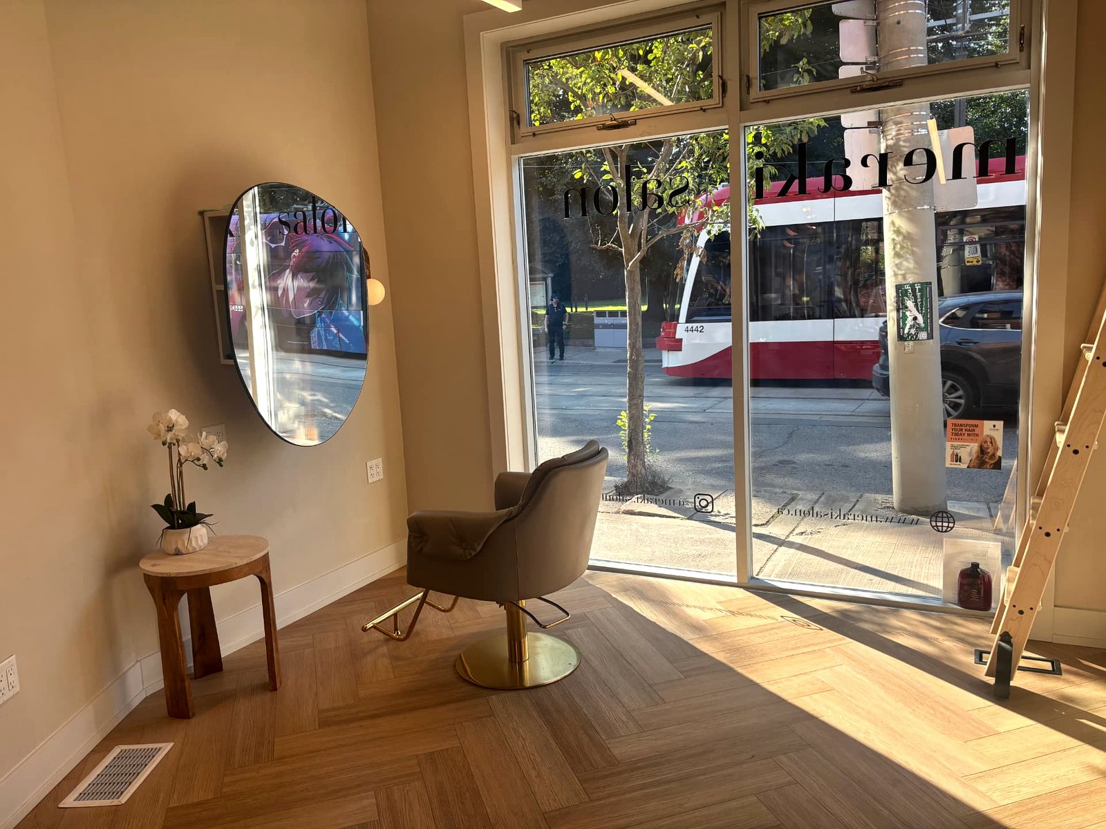 The street-facing window and styling chair at Meraki Salon in Corktown