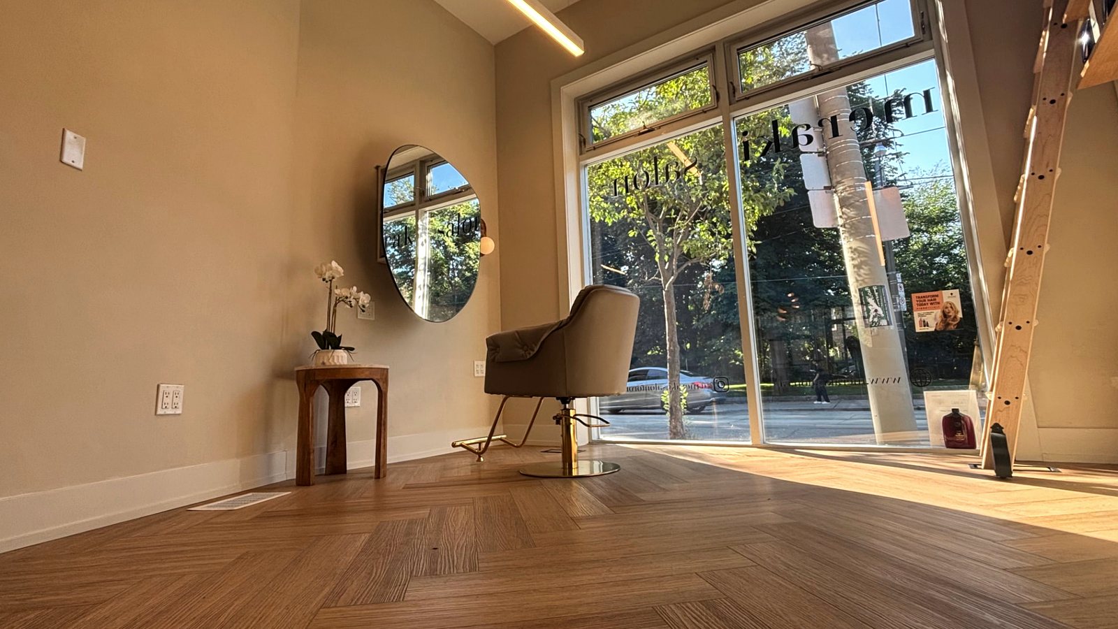 Herringbone floors and afternoon light inside Meraki Salon